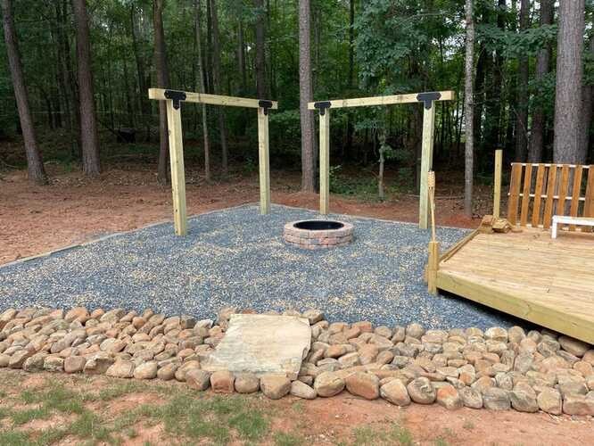 Outdoor timber structure with stone border